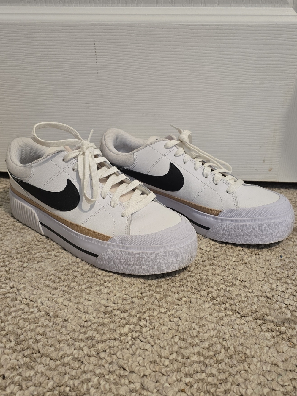Nike Court Legacy Lift White Low-Top Sneakers with Black Swoosh and Gold Stripe